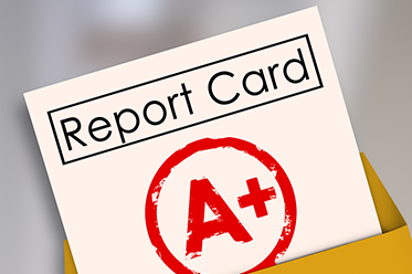 Report card with A+ in a manila envelope